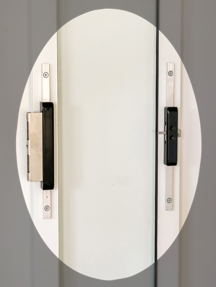 PatioLock patented adjustable locking kit fitted to a sliding-door pet insert